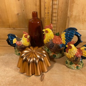 May include: A white ceramic mug with a black handle and the text "But First, Coffee" in a black, bold font. The mug is likely 4 inches tall and holds approximately 12 ounces of liquid. Perfect for enjoying your morning coffee.