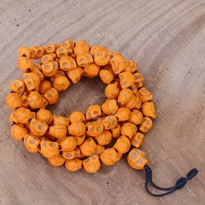 Radiant Orange Knotted Skull Mala with Adjustable Sliding Knot, Spiritual Jewelry , Skull Necklace, 108 Beads Necklace, Skull Bead Necklace
