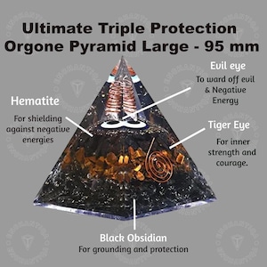 May include: A black orgonite pyramid with a copper coil, tiger eye, hematite, and black obsidian crystals. The pyramid is 95 mm in size and is labeled "Ultimate Triple Protection Orgone Pyramid Large - 95 mm".