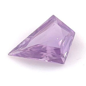 May include: A light purple gemstone with a faceted, rectangular shape.