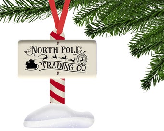 North Pole Trading Co. Santa and his Sleigh Winter Sign Shaped Hardboard Ornament