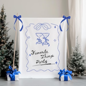 Op de afbeelding: Witte achtergrond met blauwe lint streamers en de tekst "Favorite Things Party" in zwarte schrijfletters. Twee blauwe wijnglazen zijn getekend in het midden van de achtergrond.