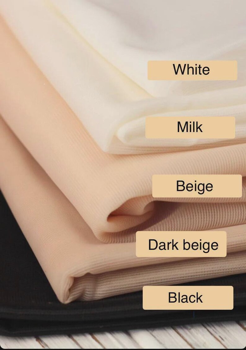 May include: A stack of fabric samples in various neutral colors. The colors include white, milk, beige, dark beige, and black. Each color is labeled with a corresponding text label.