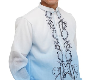 May include: A light blue and white formal shirt with intricate black embroidery. The shirt features a mandarin collar and long sleeves with buttoned cuffs. The bottom of the shirt fades to a light blue color.