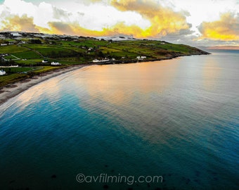 Puesta de sol en la playa de Cushendun