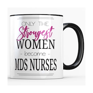 May include: White ceramic mug with a black handle and rim. The mug features the text "ONLY THE Strongest WOMEN - become - MDS NURSES" in black and pink lettering.