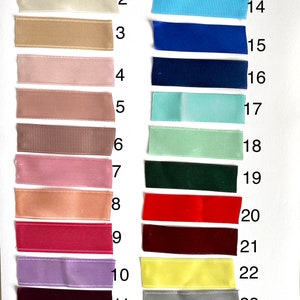 May include: A chart of 24 different ribbon colors, labeled with numbers 1 through 24. The ribbon colors include white, beige, brown, pink, red, purple, yellow, blue, green, and black.