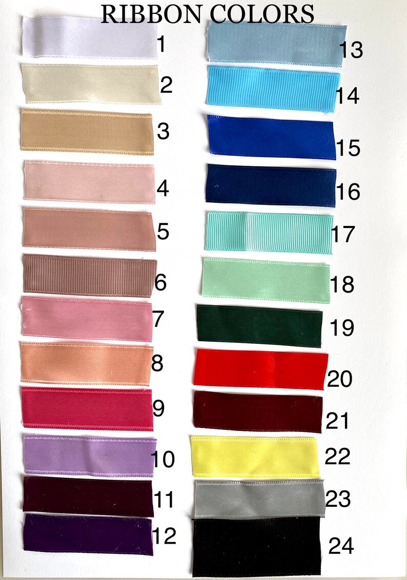 May include: A chart of 24 different ribbon colors, labeled with numbers 1 through 24. The ribbon colors include white, beige, brown, pink, red, purple, yellow, blue, green, and black.