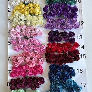 Puede incluir: Surtido de 18 colores de peque&ntilde;as flores de papel, numeradas del 1 al 18. Los colores incluyen blanco, amarillo, rosa, rosa claro, rojo, burdeos, azul, azul verdoso, azul claro, morado, lavanda y verde.