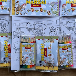 May include: A selection of children's colouring sets, each featuring characters from a popular animated film. Each set includes colouring pages and a pack of coloured pencils. The packaging displays the text "NARSAI STORY".