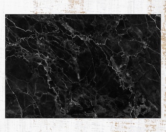 May include: Black marble background with white veining. The marble has a smooth, polished surface.