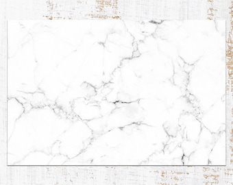 May include: White marble background with a subtle gray veining pattern. The marble has a smooth, polished surface.