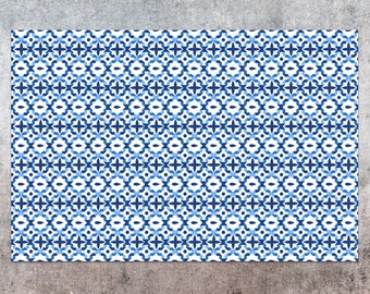 May include: A white background with a repeating pattern of blue and white geometric shapes. The pattern is made up of small squares, circles, and stars.