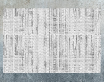 May include: A white and gray textured rug with a geometric pattern. The rug has a subtle sheen and a woven texture.