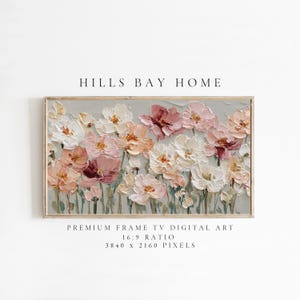 May include: A framed floral art print with a textured painting of flowers in white, peach, and pink hues. The artwork is set against a light grey background and includes the text "HILLS BAY HOME".