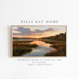 May include: A framed digital landscape painting of a marshland at sunset with golden light reflecting on the water, surrounded by tall grasses and trees. Text reads: HILLS BAY HOME, PREMIUM FRAME TV DIGITAL ART, 16:9 RATIO, 3840 x 2160 PIXELS.