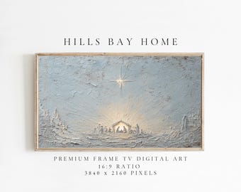 May include: A framed digital art print featuring a nativity scene with a bright star. The artwork has a textured, light blue and white color palette. The text "HILLS BAY HOME" is at the top, with "PREMIUM FRAME TV DIGITAL ART" and dimensions below.
