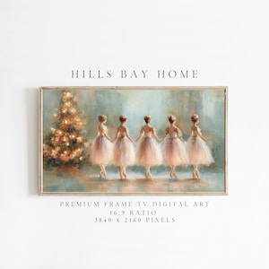 May include: A framed digital art print featuring five ballerinas in soft pink tutus, holding hands in front of a Christmas tree. The artwork has a vintage, painterly style with a light blue and gold color palette. The text "HILLS BAY HOME" is at the top.