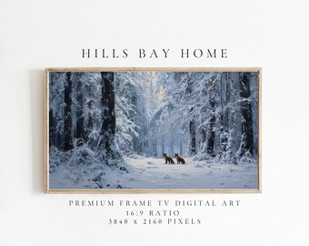 May include: A framed digital art print featuring a winter forest scene with snow-covered trees and two foxes. The artwork has a light brown frame and includes the text "HILLS BAY HOME" and "PREMIUM FRAME TV DIGITAL ART". The image ratio is 16:9, with 3840 x 2160 pixels.