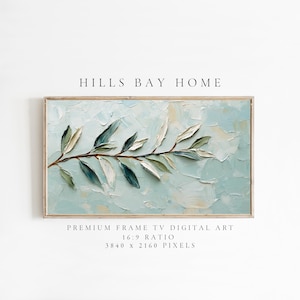 May include: A digital art print of a stylized painting of a branch with green leaves on a light blue background. The print is framed and has the text "HILLS BAY HOME" above the image and "PREMIUM FRAME TV DIGITAL ART 16:9 RATIO 3840 x 2160 PIXELS" below the image.