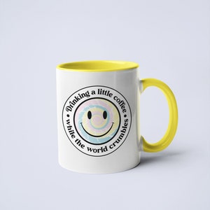 Drinking Coffee While The World Crumbles Ceramic Coffee Mug