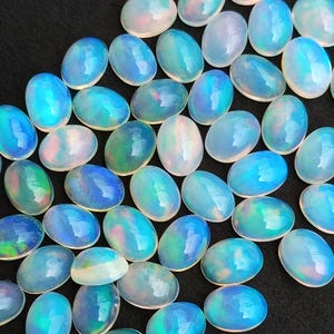Natural Ethiopian Opal Cabochon: Oval Flat Back Calibrated Gemstone (3x5MM to 8x10MM)