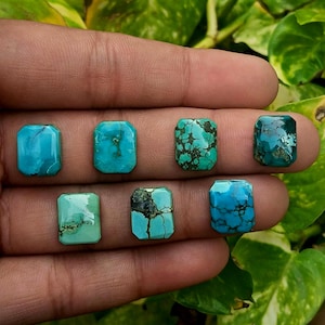 May include: Seven rectangular turquoise gemstones with polished surfaces, displaying various shades of blue and green with unique dark brown matrix veining patterns. Each stone features smooth, flat faces and straight edges, showcasing natural colour variations.