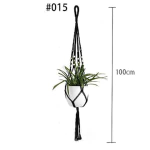 May include: Black macrame plant hanger with wooden beads and a white pot. The hanger is 100 cm long. #015