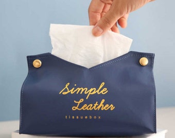 May include: A blue leather tissue box cover with gold accents and the text "Simple Leather tissuebox" in gold lettering.