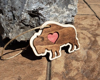 Wooden Buffalo Heart Ornament. Hand crafted and laser engraved. 4" Diameter and 1/4" thick.