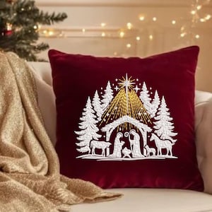 May include: A white ceramic mug with a black handle and the text "But First, Coffee" in a black, handwritten-style font. The mug is on a white surface.