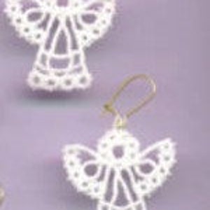 May include: A pair of white lace angel earrings with gold hooks.