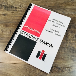 May include: A white operator's manual for International 454, 474, 475, 574,674 tractors, 2400 & 2500 industrial tractors. The manual has a red and black cover with the International Harvester logo.