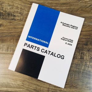 May include: A white parts catalog for International 4-cylinder engines, featuring a blue and black design. The catalog covers gasoline and LP engines, specifically model C-200.