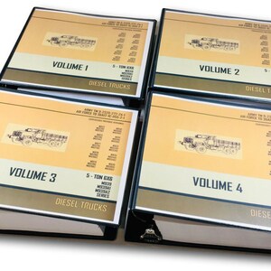 May include: Four black binders with yellow and brown covers. Each binder has a title that reads "Volume 1", "Volume 2", "Volume 3", and "Volume 4". Each binder also has the text "5-TON 6X6 M35A1 M35A2 M35A3 SERIES DIESEL TRUCKS".