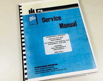 May include: A service manual with a blue cover and white text. The title "Service Manual" is prominently displayed. The manual includes information on International Backhoes, Truck Mounts, and Loaders. The manual is bound with a black and white spiral.