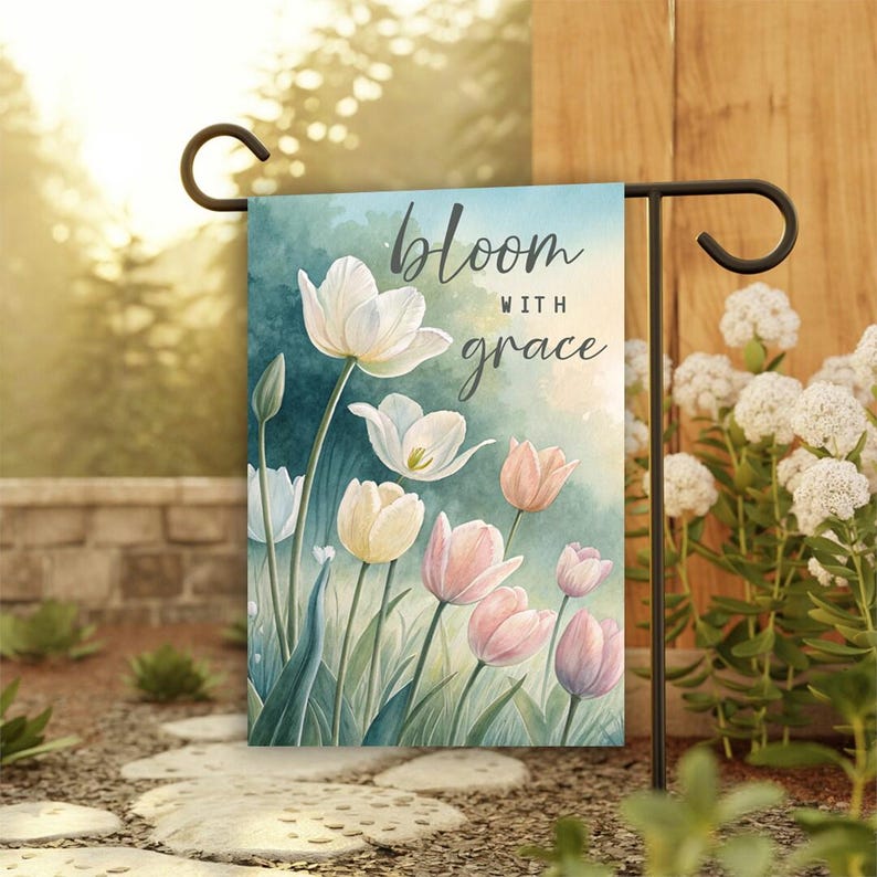 May include: A garden flag with a watercolor design of pink and white tulips. The flag has the text "bloom with grace" on it.