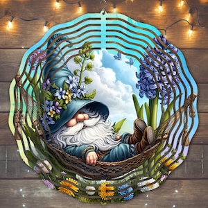 May include: A blue gnome with a white beard is relaxing in a hammock surrounded by flowers. The gnome is wearing a blue hat with flowers on it. The background is a blue and green sky with clouds.