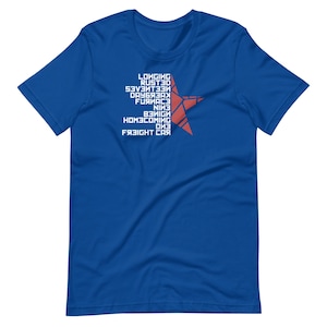 May include: Royal blue t-shirt with white text and a red star design. The text includes words like "Longing", "Rusted", and "Freight Car". The star is made of red lines. A casual tee for everyday wear.