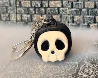 Llavero con clicker de calavera - Juguete sensorial para el TDAH