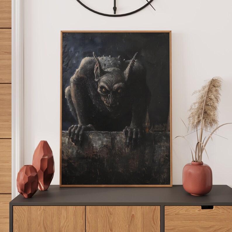 May include: A black and white framed print of a dark, shadowy creature with large, pointed ears and sharp teeth. The creature is perched on a ledge, looking directly at the viewer.