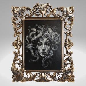 May include: A black and white illustration of Medusa, a mythical Greek creature with snakes for hair, framed in a gold ornate frame.