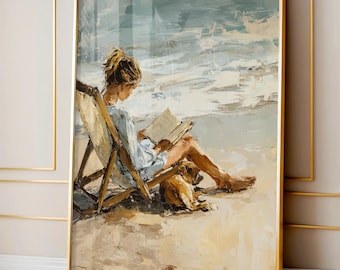 May include: A framed art print depicts a person reading a book while seated in a beach chair, with a dog resting nearby. The artwork features a beach scene with a light blue sky and ocean, and a sandy beach. The frame is gold.
