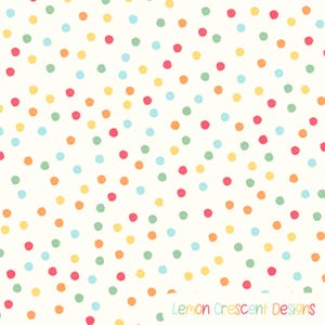 May include: A white fabric surface featuring a repeating pattern of small, hand-drawn style dots in shades of pink, yellow, light blue, orange, and light green. The text Lemon Crescent Designs is printed in the bottom right corner in a light font.