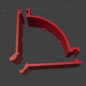 May include: Three red plastic corner pieces for a shelf or other furniture. The pieces are designed to fit together to create a 90-degree angle.