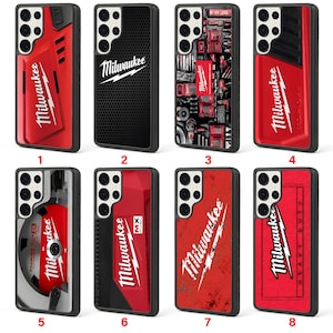 May include: A collection of eight phone cases, each featuring the "Milwaukee" logo and branding. The cases showcase a variety of designs, including red and black color schemes, tool-inspired graphics, and the "MX FUEL" logo. The cases are designed for a smartphone.