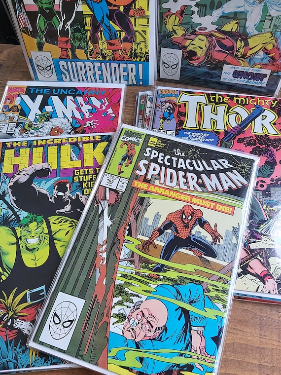 1990's Vintage gift for him the Comics shown on a table feature the Marvel superheroes Spider-Man, Hulk, Thor, X-men. There is 3 different comics in each pack. An ideal birthday present or gift for men