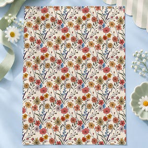 May include: A rectangular A2 size sheet measuring 42x59cm featuring a repeating pattern of wildflowers in shades of red, orange, yellow, and blue on a cream background, with thin green stems and leaves connecting the floral elements.