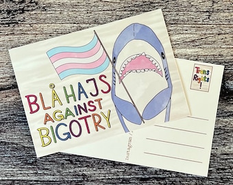 Blåhajs against bigotry trans pride shark plushy postcard