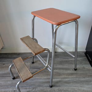 Vintage foldable orange metal and wooden kitchen step stool from the 70/80s